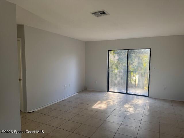 2232 Flower Tree Circle Melbourne, FL 32935 - Photo 6 of 13 a view of an empty room with a window