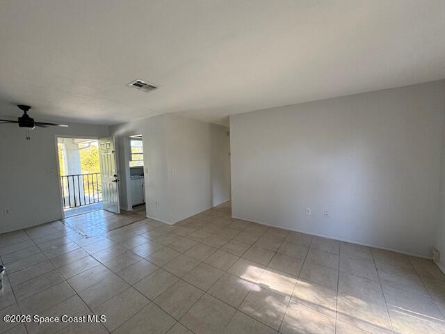 2232 Flower Tree Circle Melbourne, FL 32935 - Photo 7 of 13 an empty room with windows and entrance