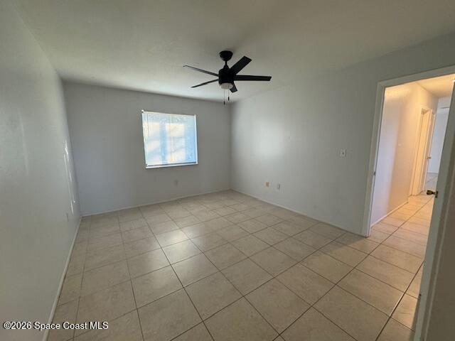 2232 Flower Tree Circle Melbourne, FL 32935 - Photo 9 of 17 an empty room with windows and fan