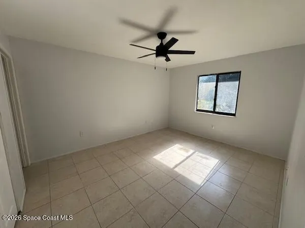 a view of an empty room and window