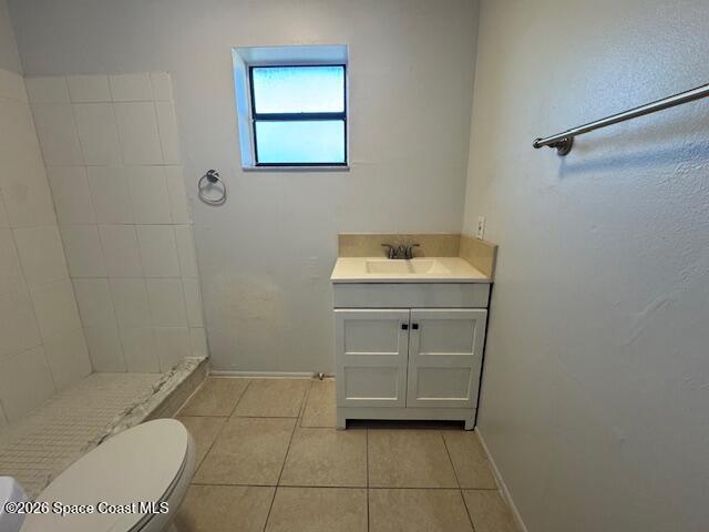 2232 Flower Tree Circle Melbourne, FL 32935 - Photo 10 of 17 a bathroom with a sink a toilet and a mirror