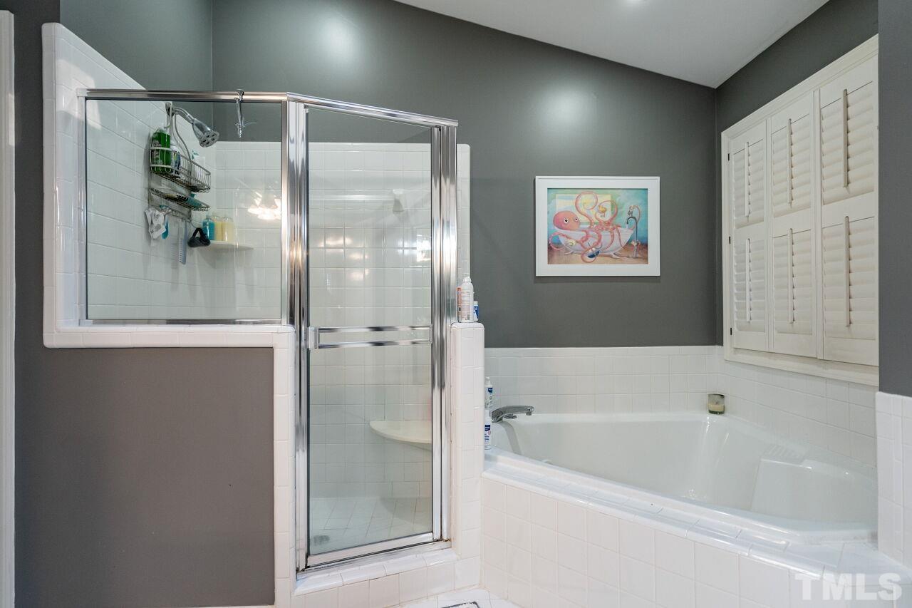 1904 White Oak Road Raleigh, NC 27608 - Photo 22 of 30 a bathroom with a bathtub and a shower