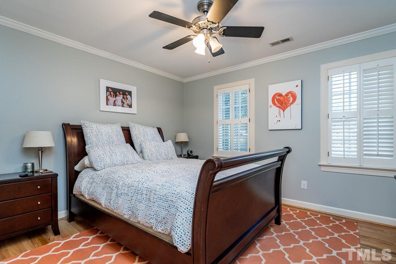 1904 White Oak Road Raleigh, NC 27608 - Photo 23 of 30 a bedroom with a bed and a window