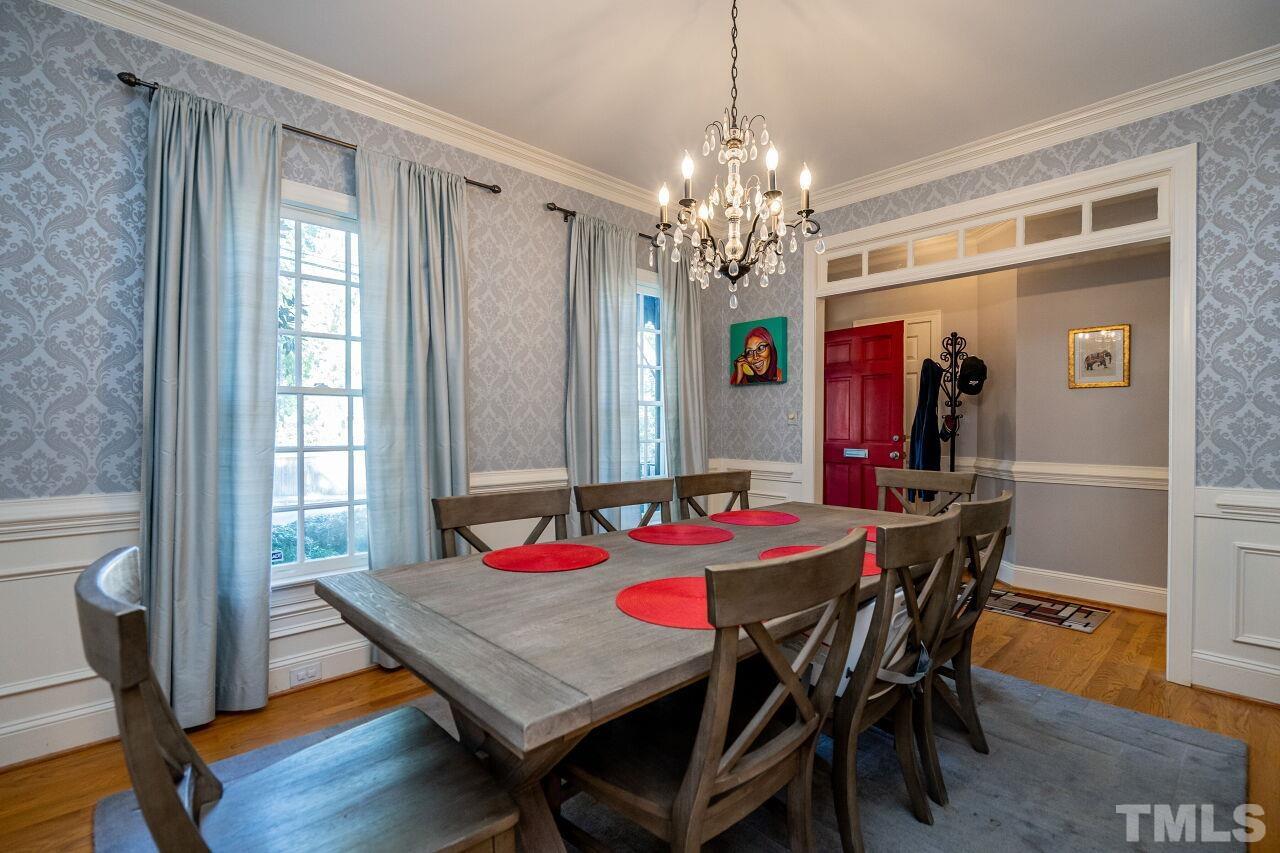 1904 White Oak Road Raleigh, NC 27608 - Photo 8 of 30 a view of a dining room with furniture window and wooden floor