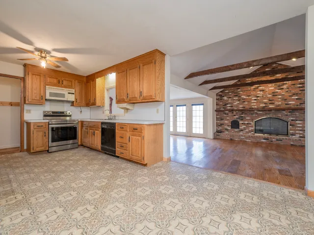 a kitchen with a stove a sink and a refrigerator