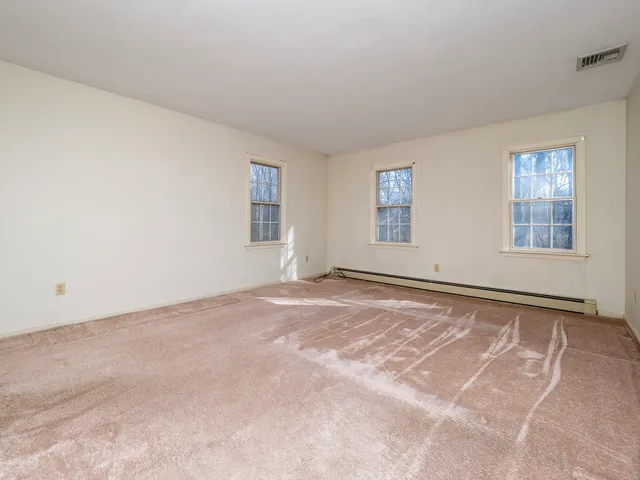 a view of an empty room with windows