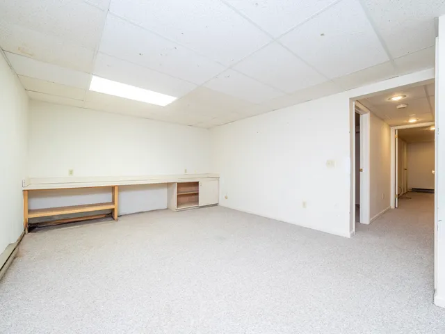 a view of an empty room with windows