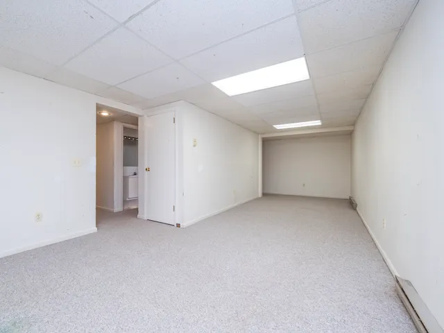 an empty room with a empty space and windows