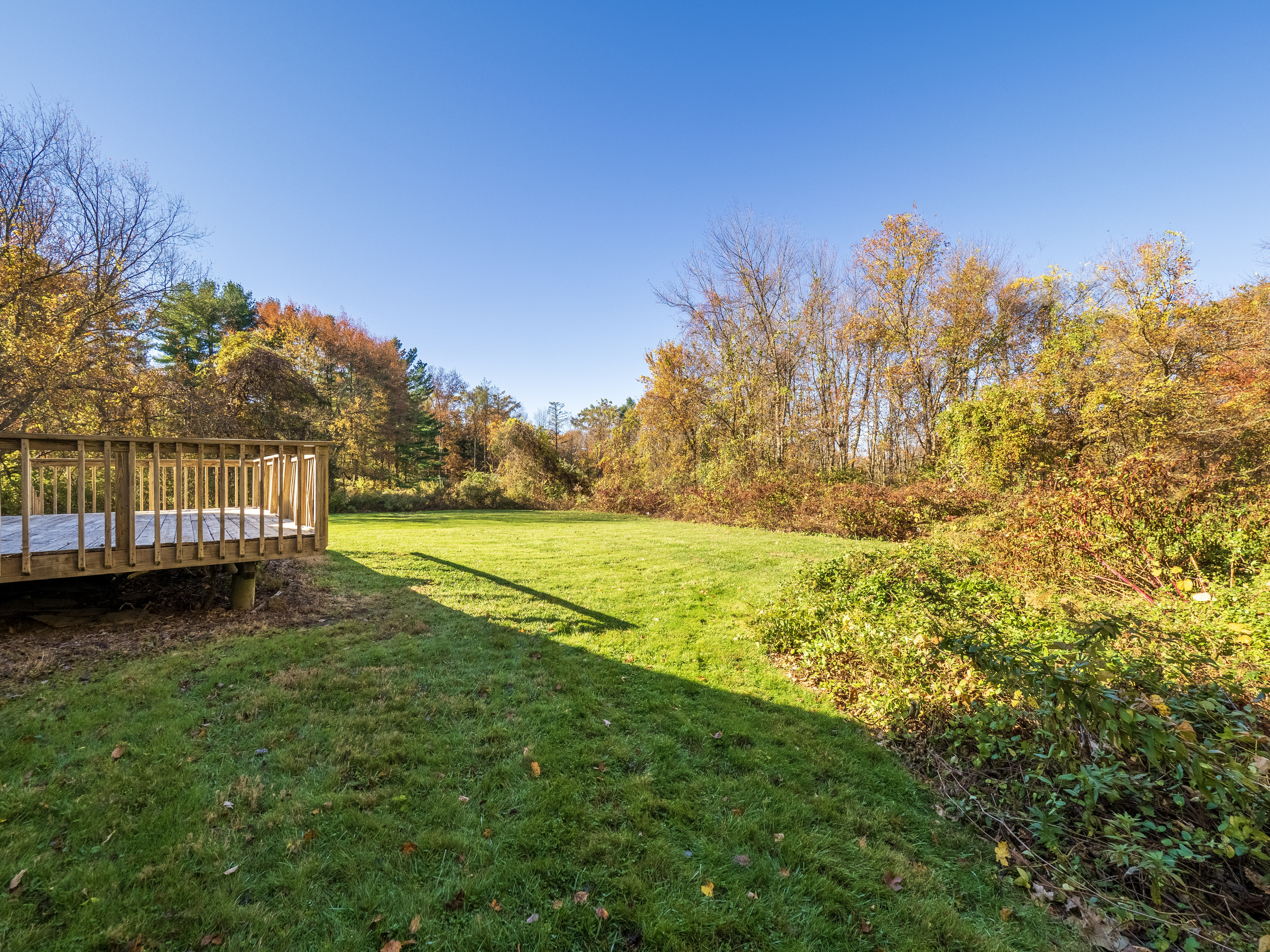 41 Sullivan Drive Redding, CT 06896 - Photo 31 of 32 a view of a yard with wooden fence