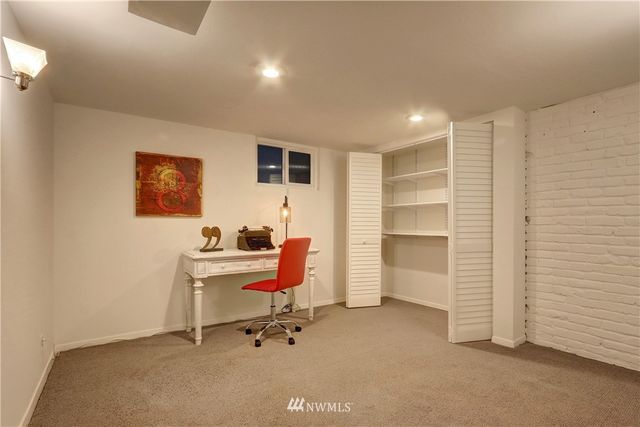 a view of a workspace with furniture