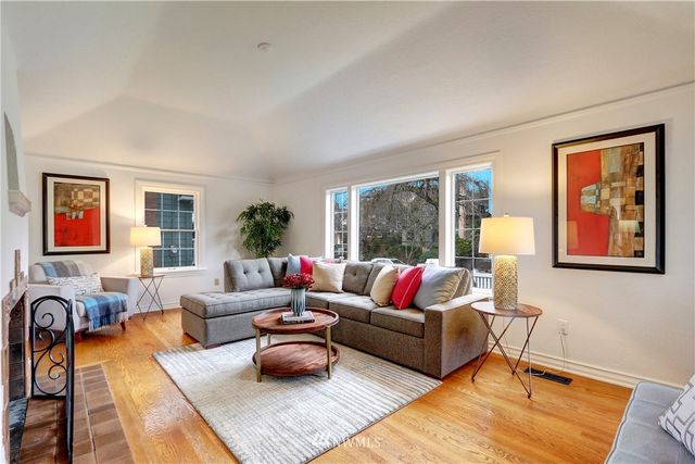 a living room with furniture rug and window