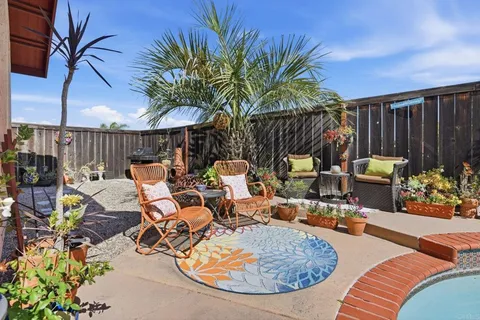 a view of a chairs and tables in patio