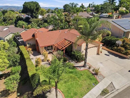 an aerial view of house with yard