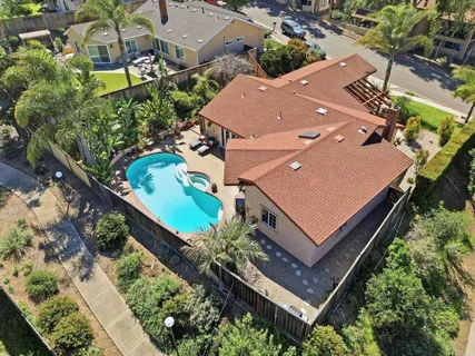 an aerial view of a house with a garden