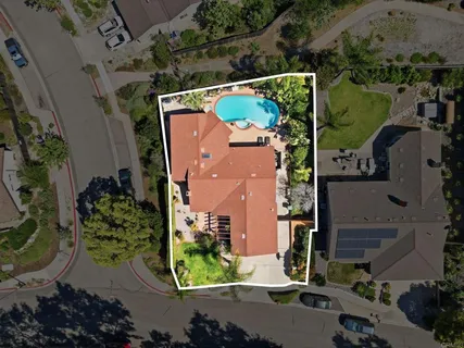 an aerial view of houses with outdoor space