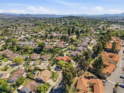 an aerial view of a city with lots of residential buildings