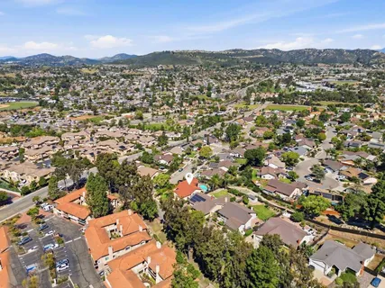 an aerial view of residential houses with outdoor space