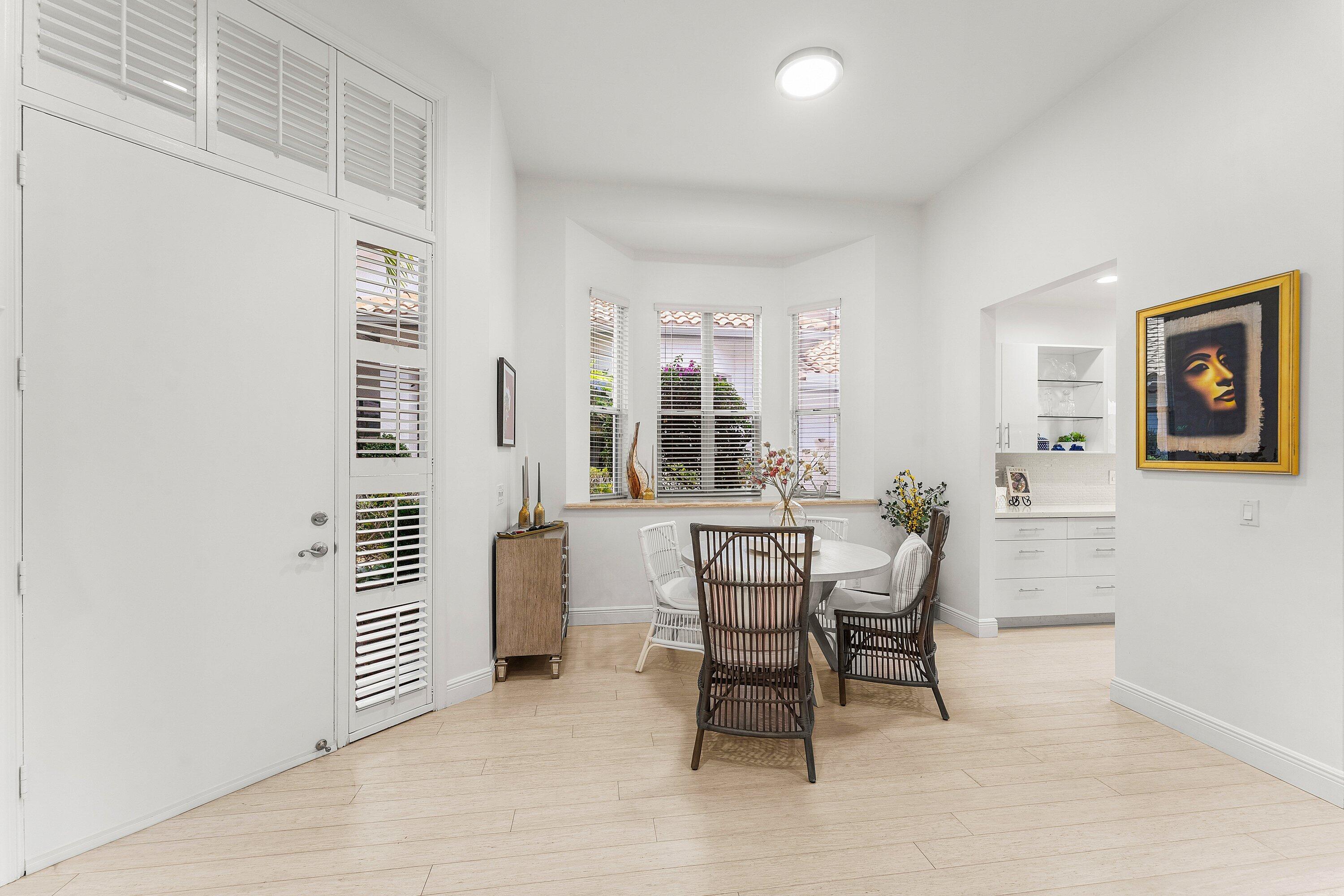 2221 Northwest 62nd Drive Boca Raton, FL 33496 - Photo 16 of 62 a dining room with furniture and window