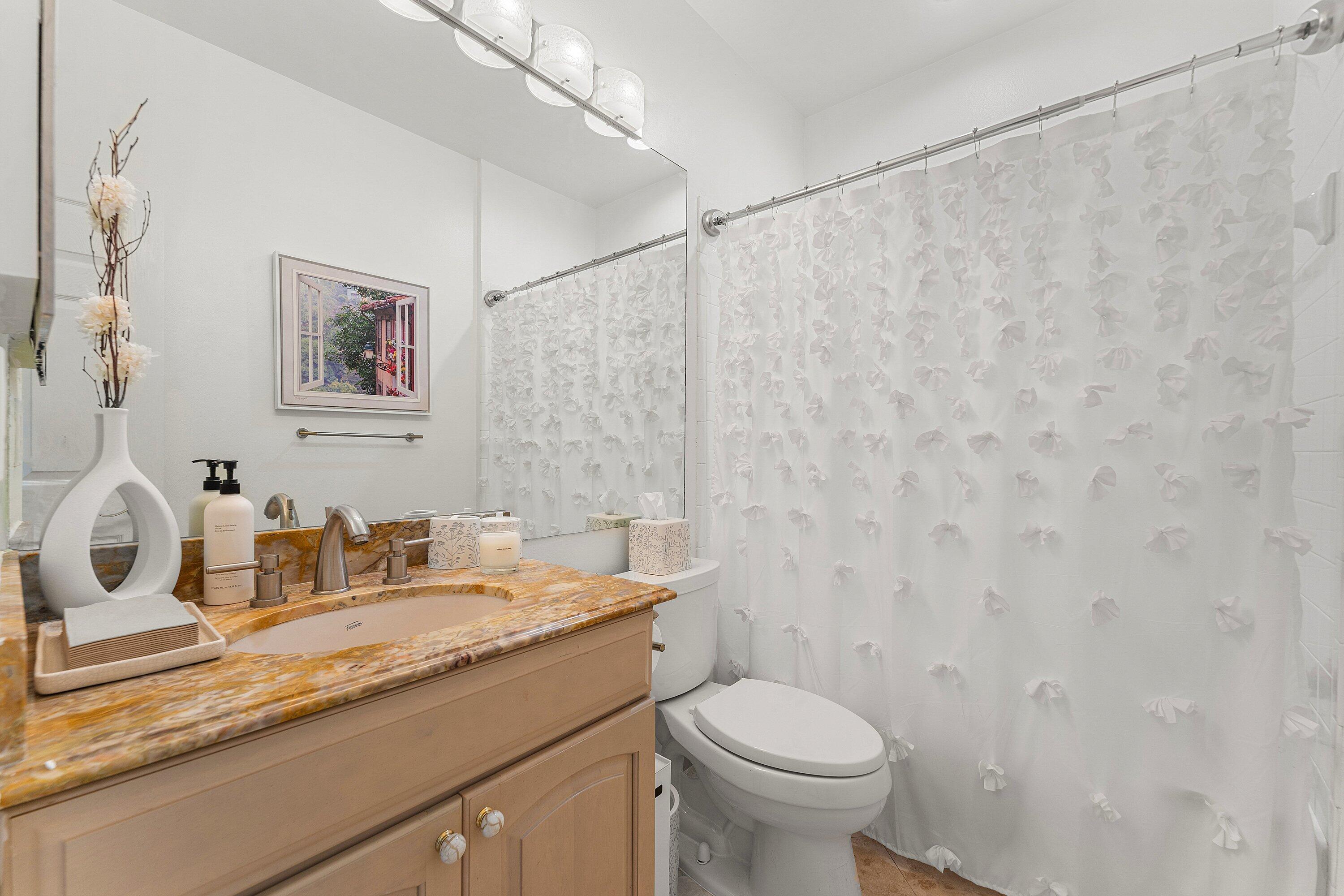 2221 Northwest 62nd Drive Boca Raton, FL 33496 - Photo 24 of 62 a bathroom with a granite countertop sink and a toilet