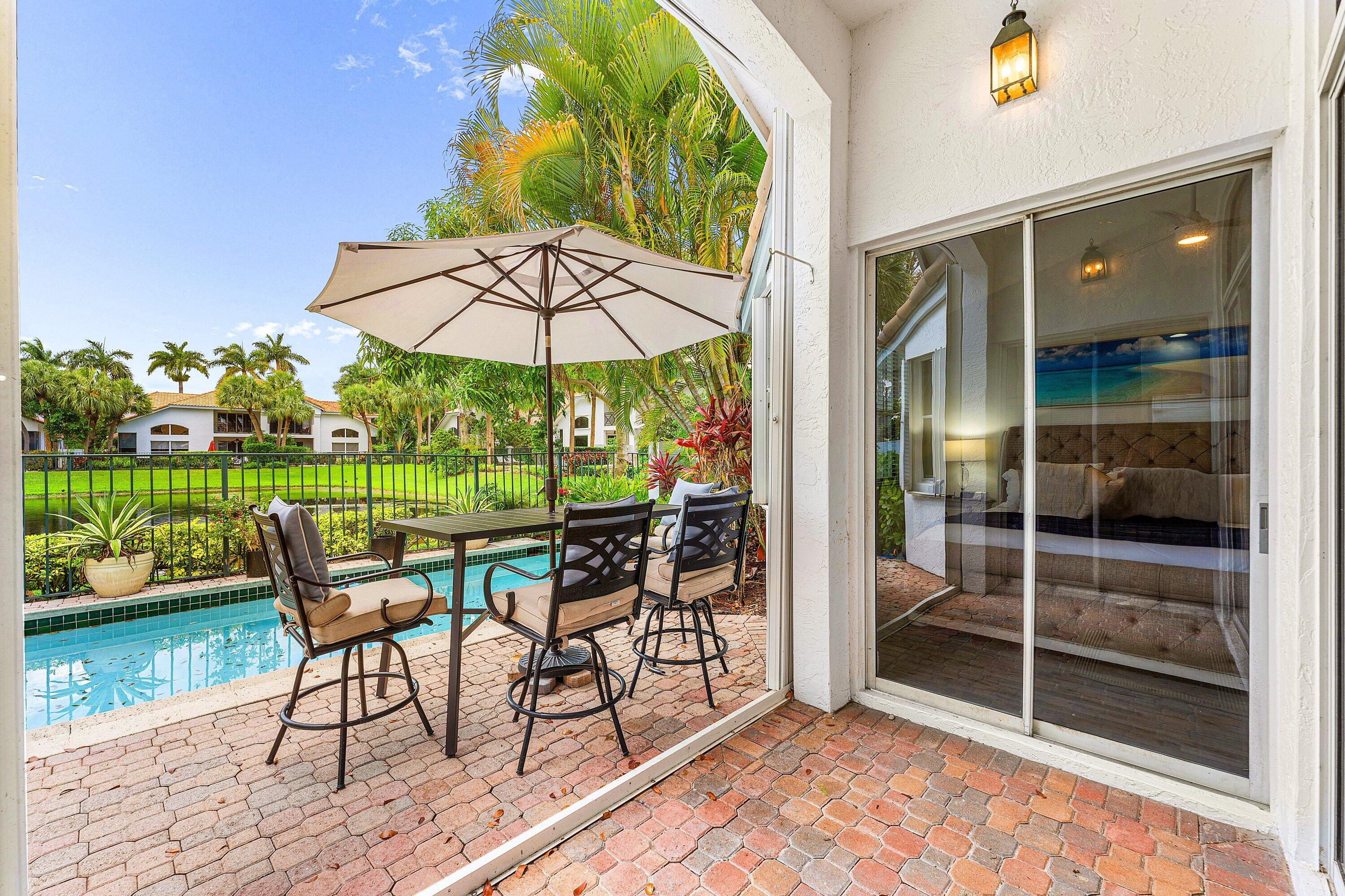 2221 Northwest 62nd Drive Boca Raton, FL 33496 - Photo 27 of 62 a view of a chair and tables in the garden