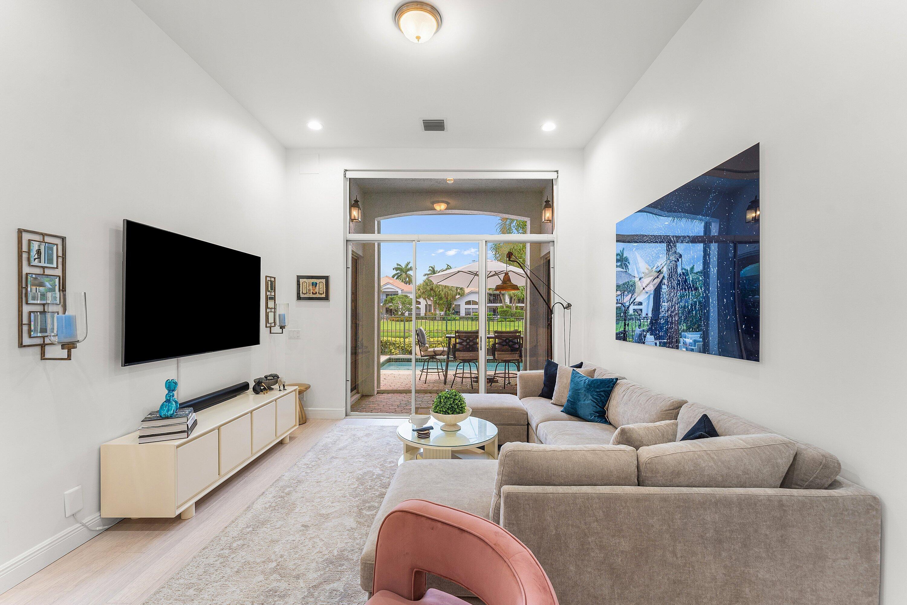 2221 Northwest 62nd Drive Boca Raton, FL 33496 - Photo 3 of 62 a living room with furniture and a flat screen tv