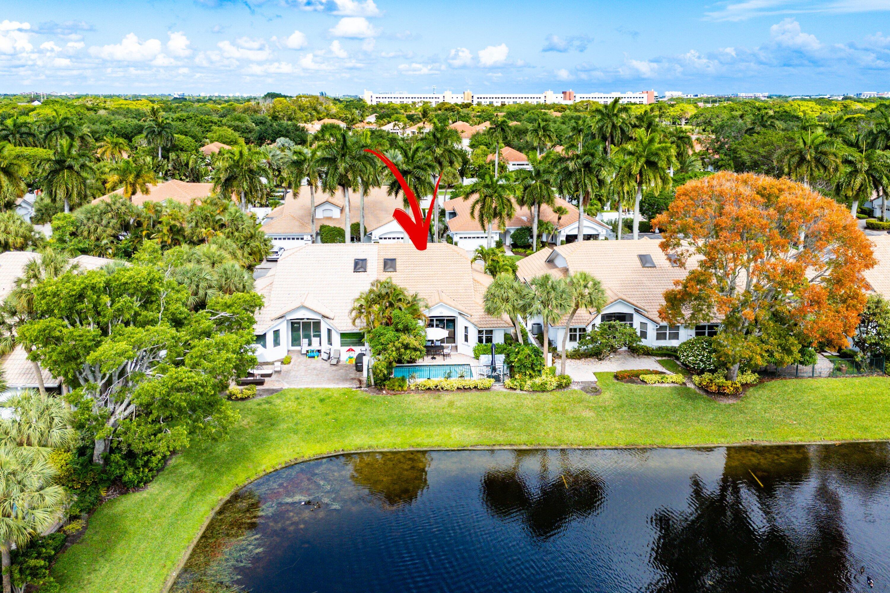 2221 Northwest 62nd Drive Boca Raton, FL 33496 - Photo 38 of 62 an aerial view of a house with a yard and lake view