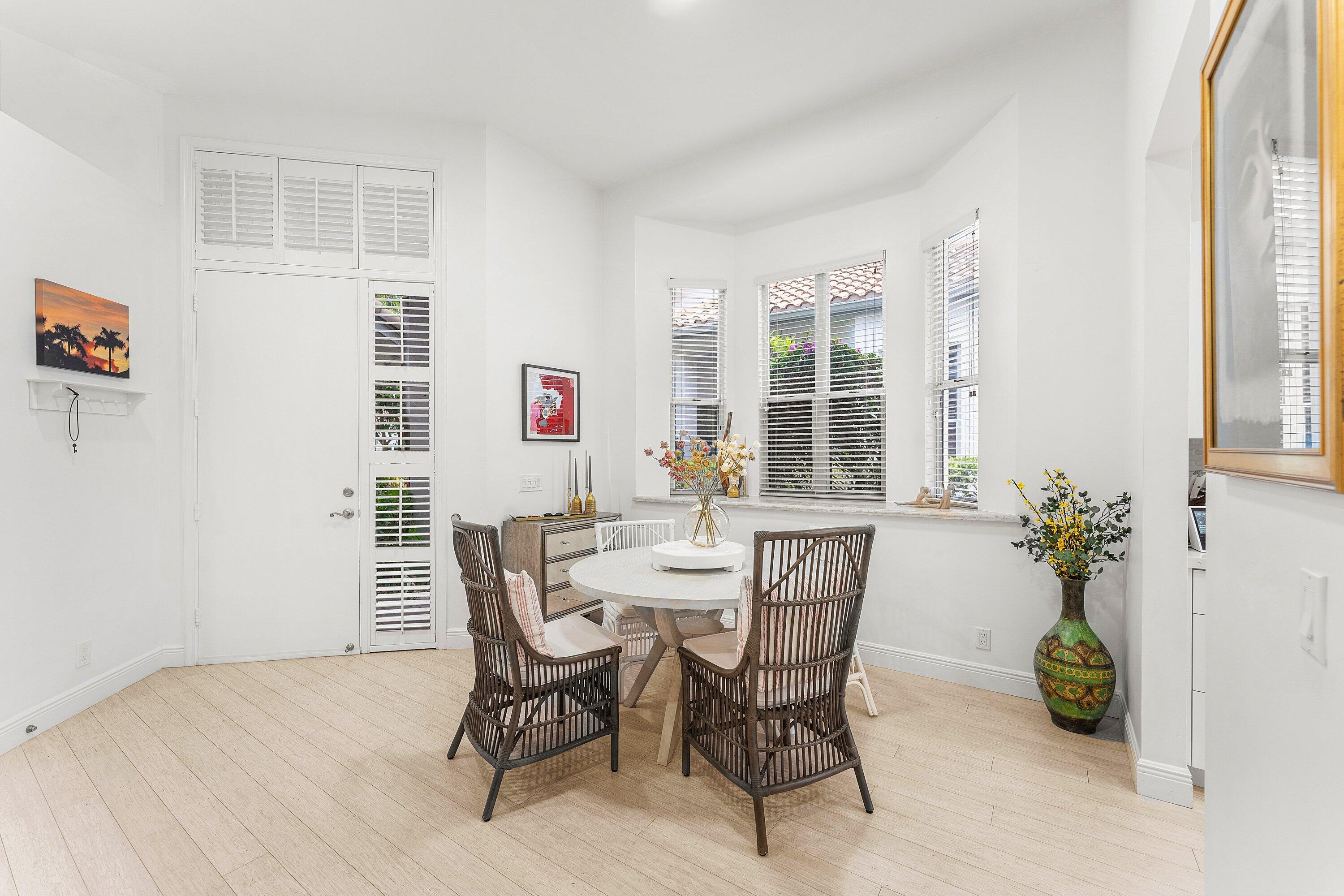 2221 Northwest 62nd Drive Boca Raton, FL 33496 - Photo 9 of 62 a view of a dining room with furniture and windows