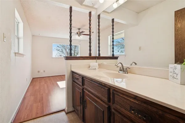 a bathroom with a sink and a mirror