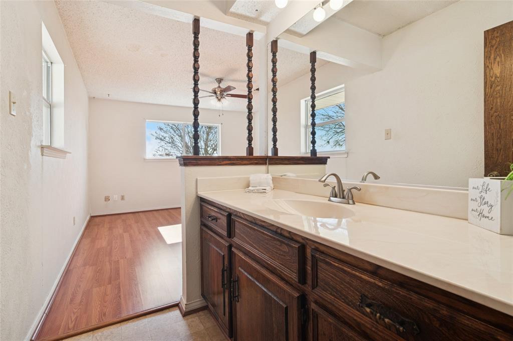 941 Maple Street Howe, TX 75459 - Photo 16 of 37 a bathroom with a sink and a mirror