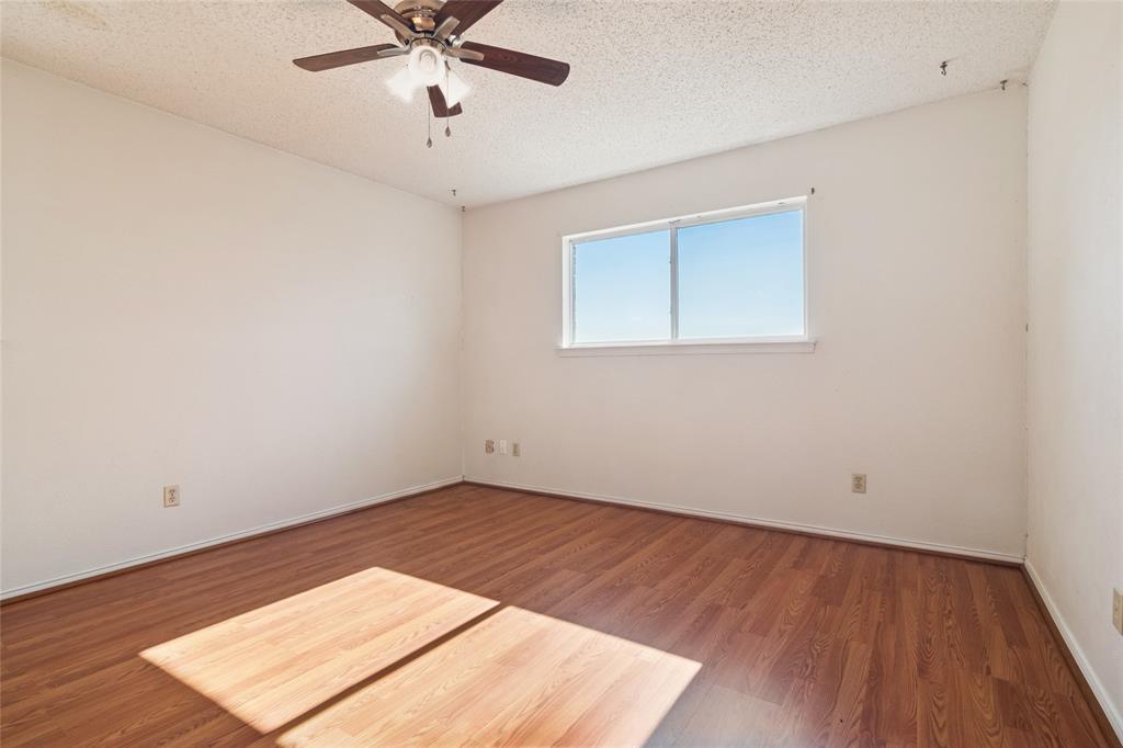 941 Maple Street Howe, TX 75459 - Photo 21 of 37 a view of an empty room with wooden floor