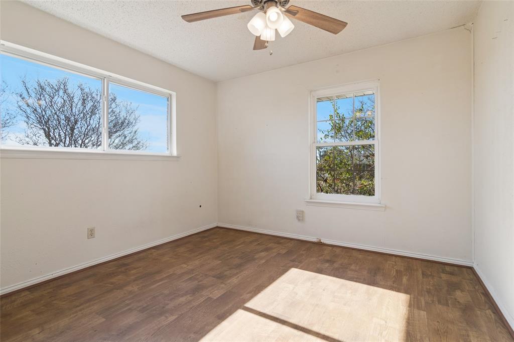 941 Maple Street Howe, TX 75459 - Photo 23 of 37 a view of an empty room with a window and wooden floor