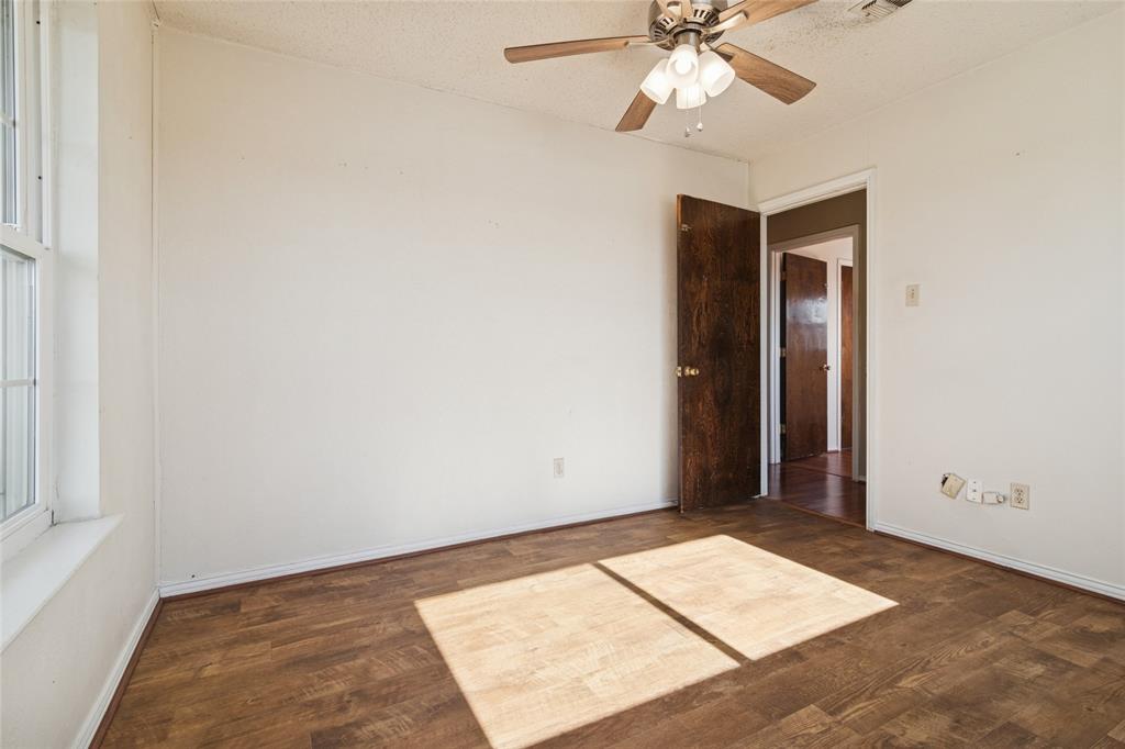 941 Maple Street Howe, TX 75459 - Photo 24 of 37 an empty room with fan and a window