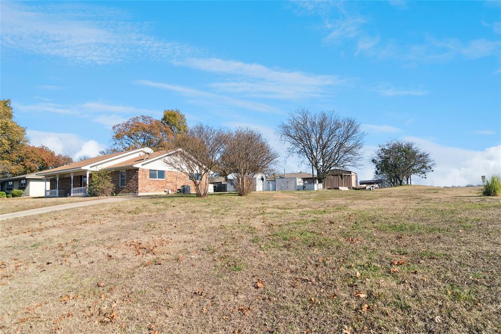 941 Maple Street Howe, TX 75459 - Photo 28 of 37 a view of a house with a yard