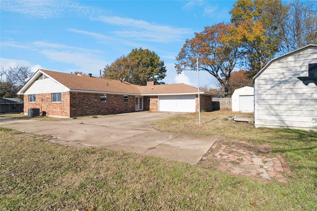 941 Maple Street Howe, TX 75459 - Photo 30 of 37 a front view of a house with a yard and garage