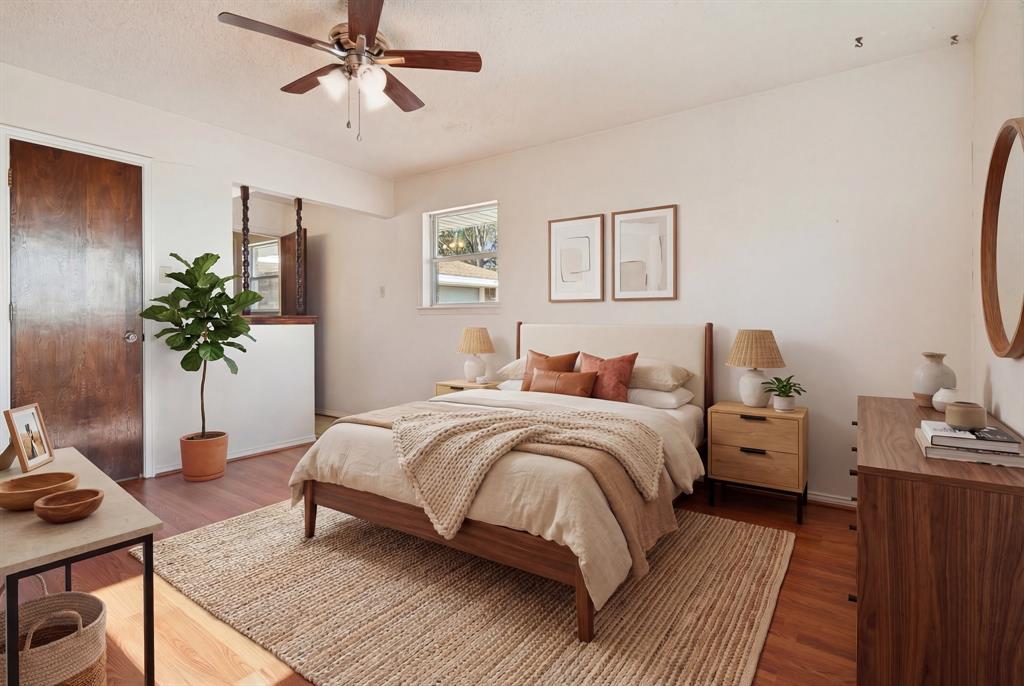 941 Maple Street Howe, TX 75459 - Photo 36 of 37 a bedroom with a bed and a potted plant on the dresser