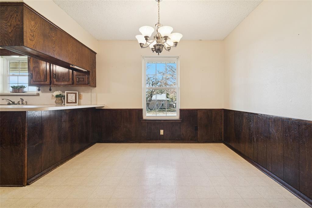 941 Maple Street Howe, TX 75459 - Photo 10 of 37 a bedroom with a bed and a cabinets