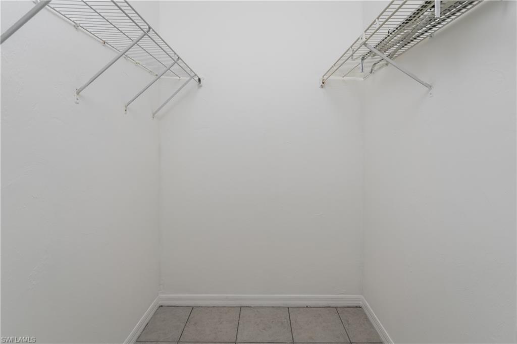 5501 Rattlesnake Hammock Road, Unit 601 Naples, FL 34113 - Photo 13 of 21 a view of a room with racks on the wall