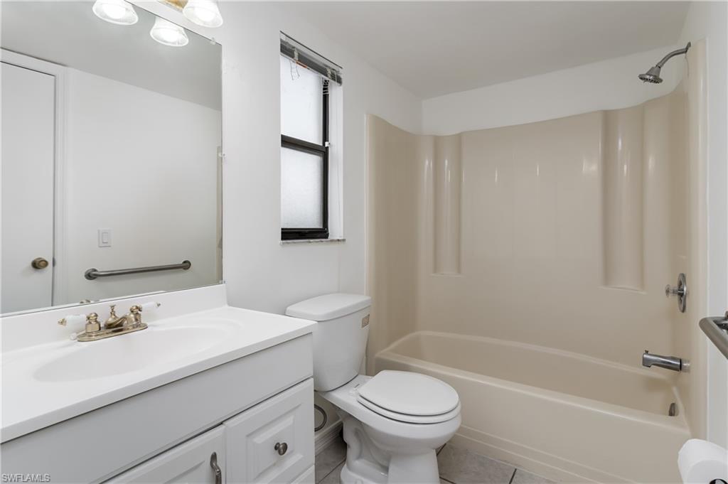 5501 Rattlesnake Hammock Road, Unit 601 Naples, FL 34113 - Photo 14 of 21 a bathroom with a sink toilet and shower