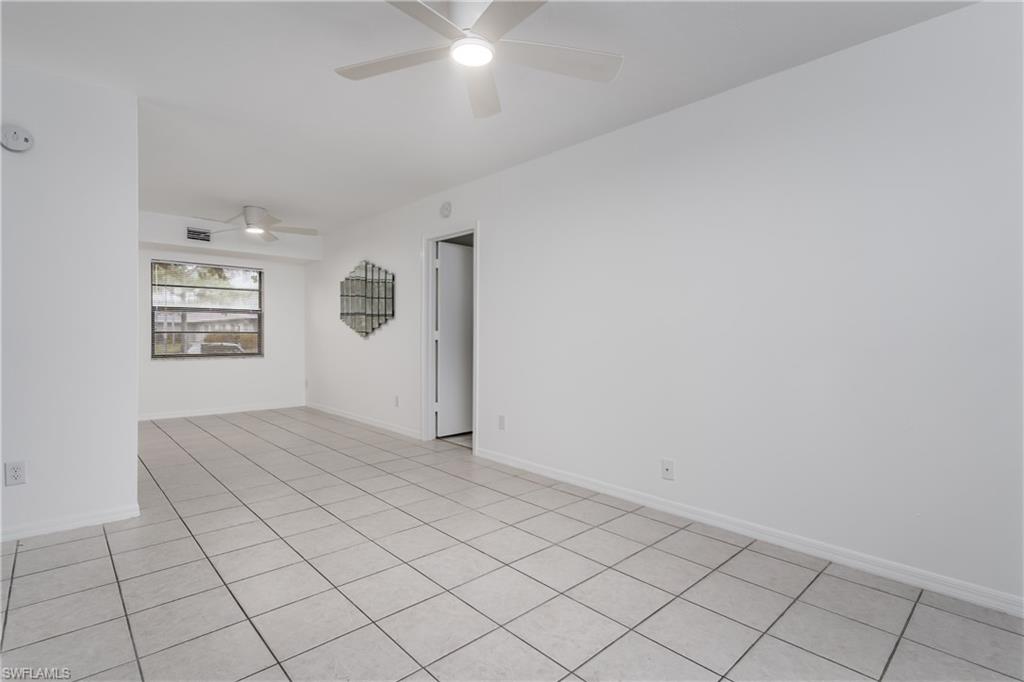 5501 Rattlesnake Hammock Road, Unit 601 Naples, FL 34113 - Photo 8 of 21 an empty room with windows