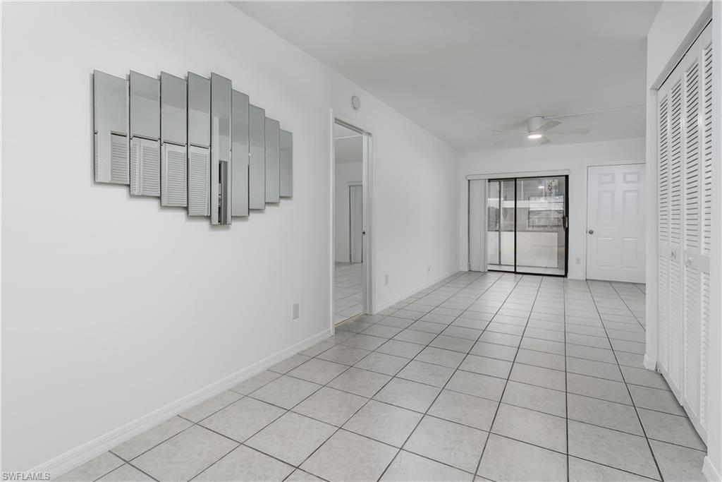 5501 Rattlesnake Hammock Road, Unit 601 Naples, FL 34113 - Photo 10 of 21 a view of a livingroom with an empty space and window