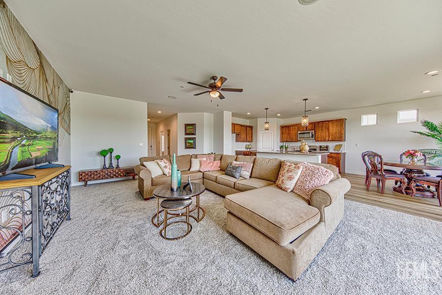 Undisclosed Address Bakersfield, CA 93311 - Photo 1 of 9 a living room with furniture and a flat screen tv