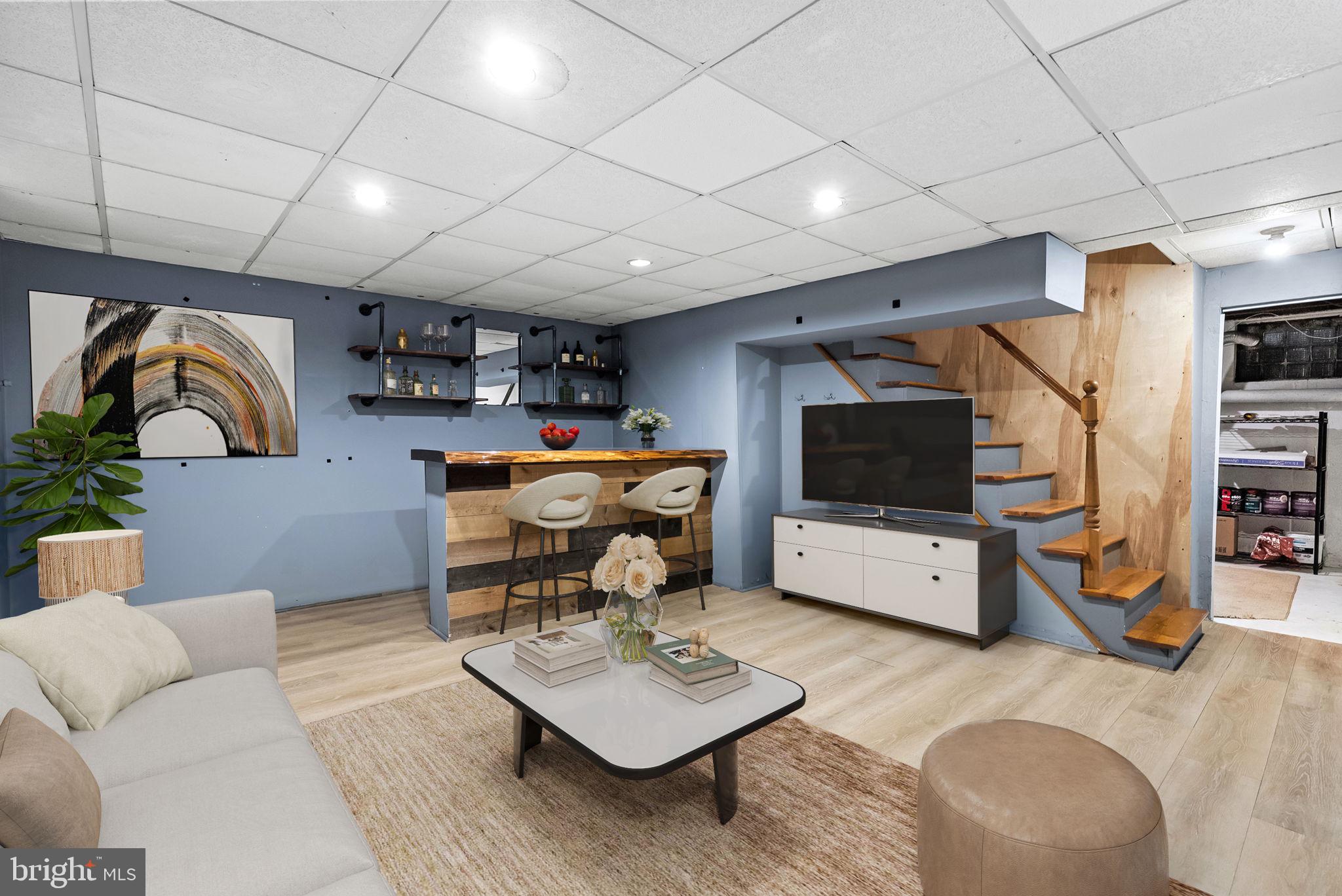 215 Allison Road Oreland, PA 19075 - Photo 16 of 39 a living room with furniture and a flat screen tv