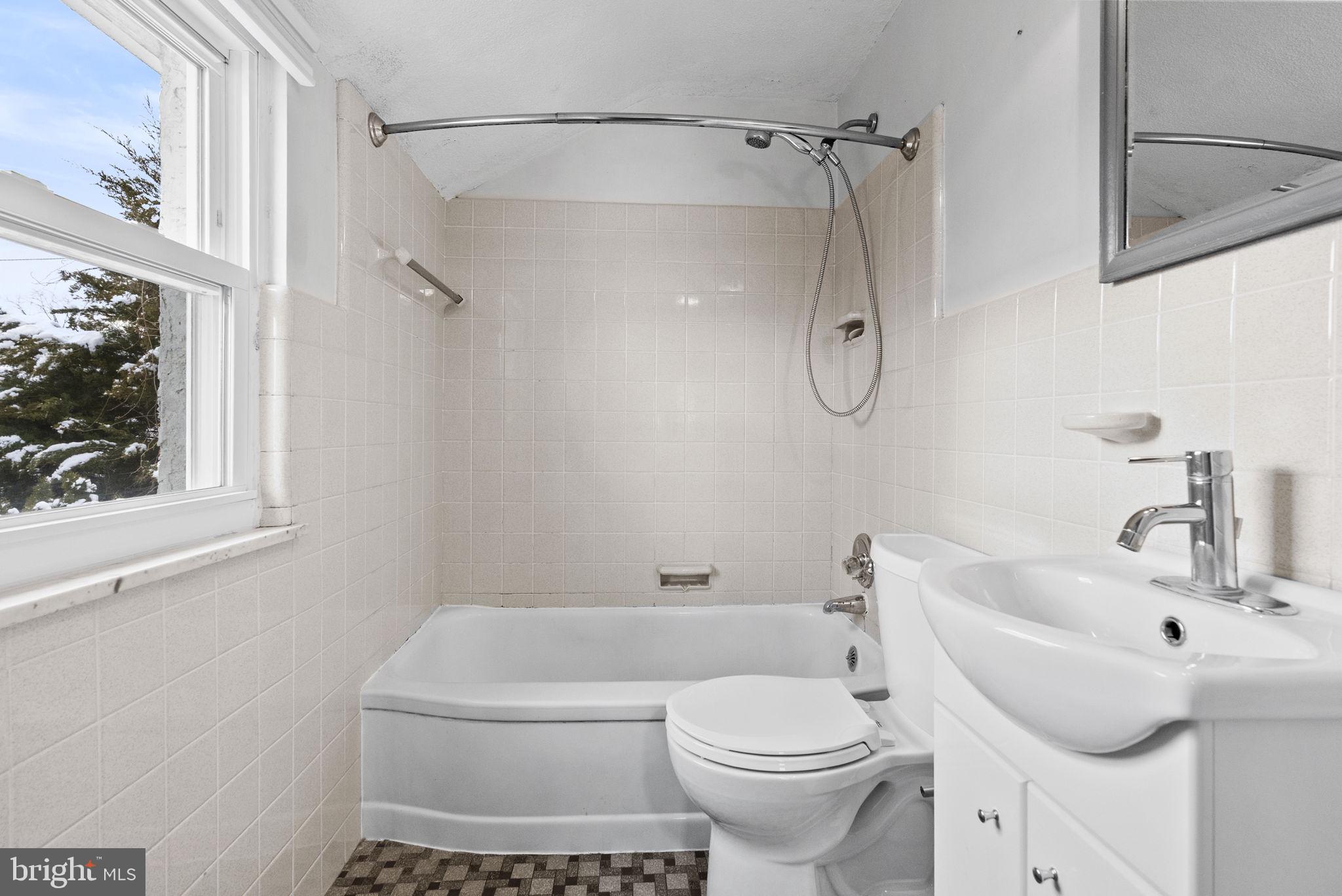 215 Allison Road Oreland, PA 19075 - Photo 24 of 39 a bathroom with a toilet sink and shower