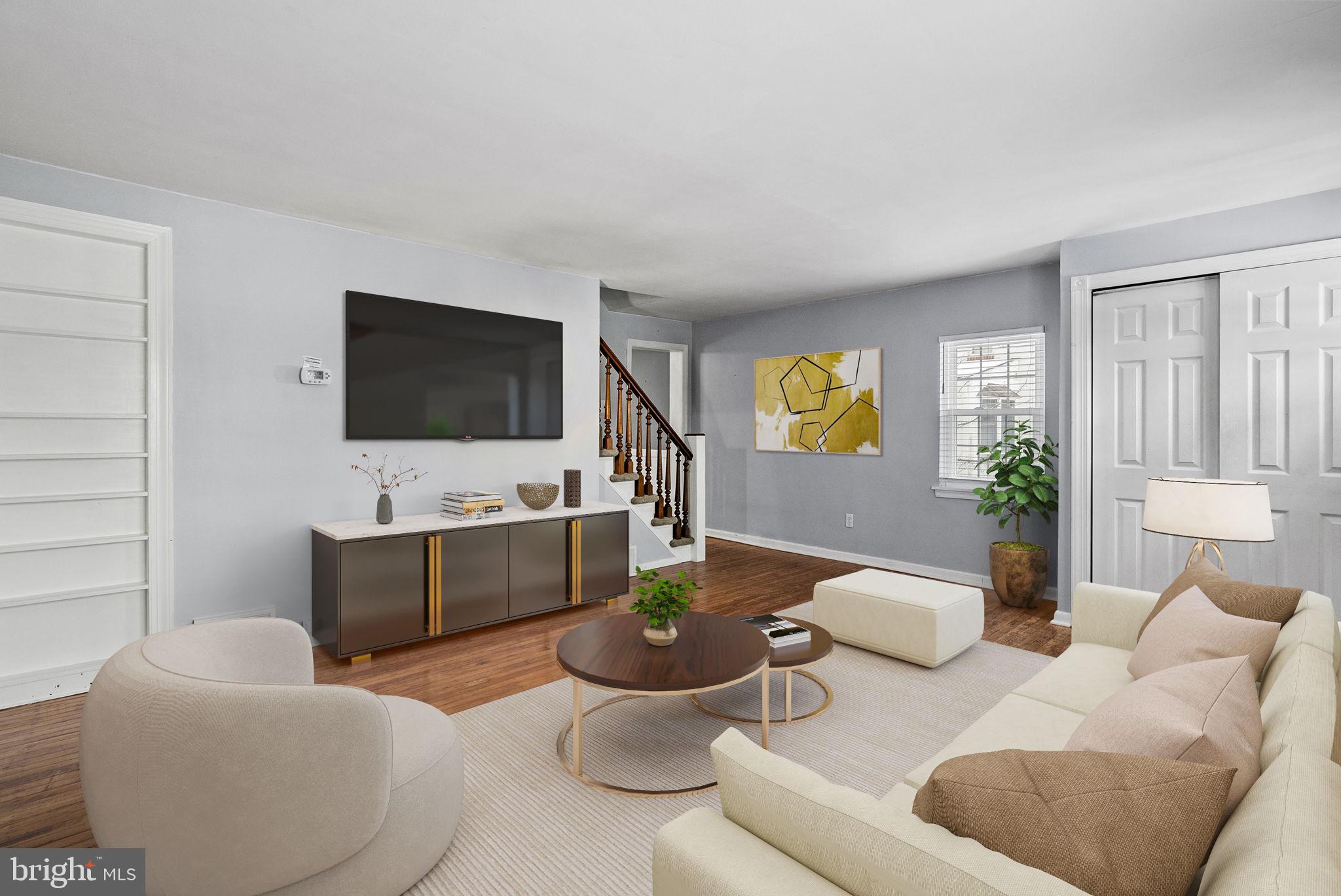 215 Allison Road Oreland, PA 19075 - Photo 5 of 39 a living room with furniture and a flat screen tv
