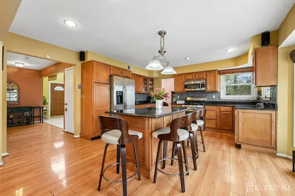 a view of a dining room kitchen with furniture and wooden floor
