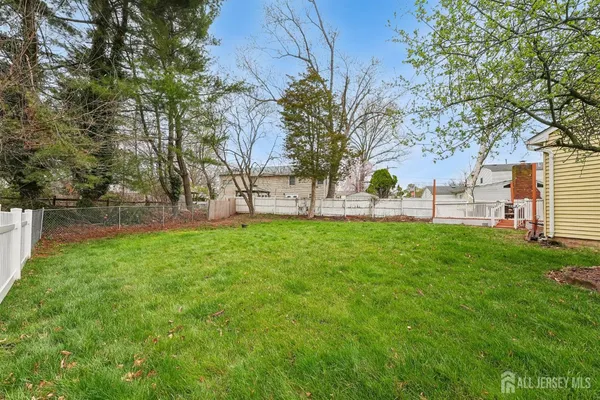 a view of a yard with a tree