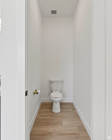 2862 South Mountain Rnch Road Cedar City, UT 84720 - Photo 27 of 64 Compact powder room featuring wood-finish flooring, white baseboards, and a white toilet