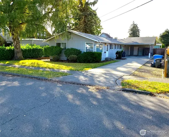 a view of a house with swimming pool and a yard