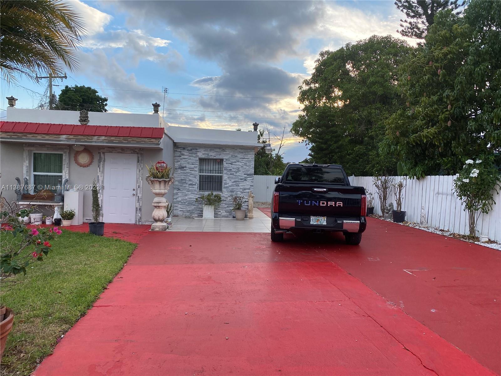 29220 Kansas Road Homestead, FL 33033 - Photo 3 of 16 a house view with a garden space