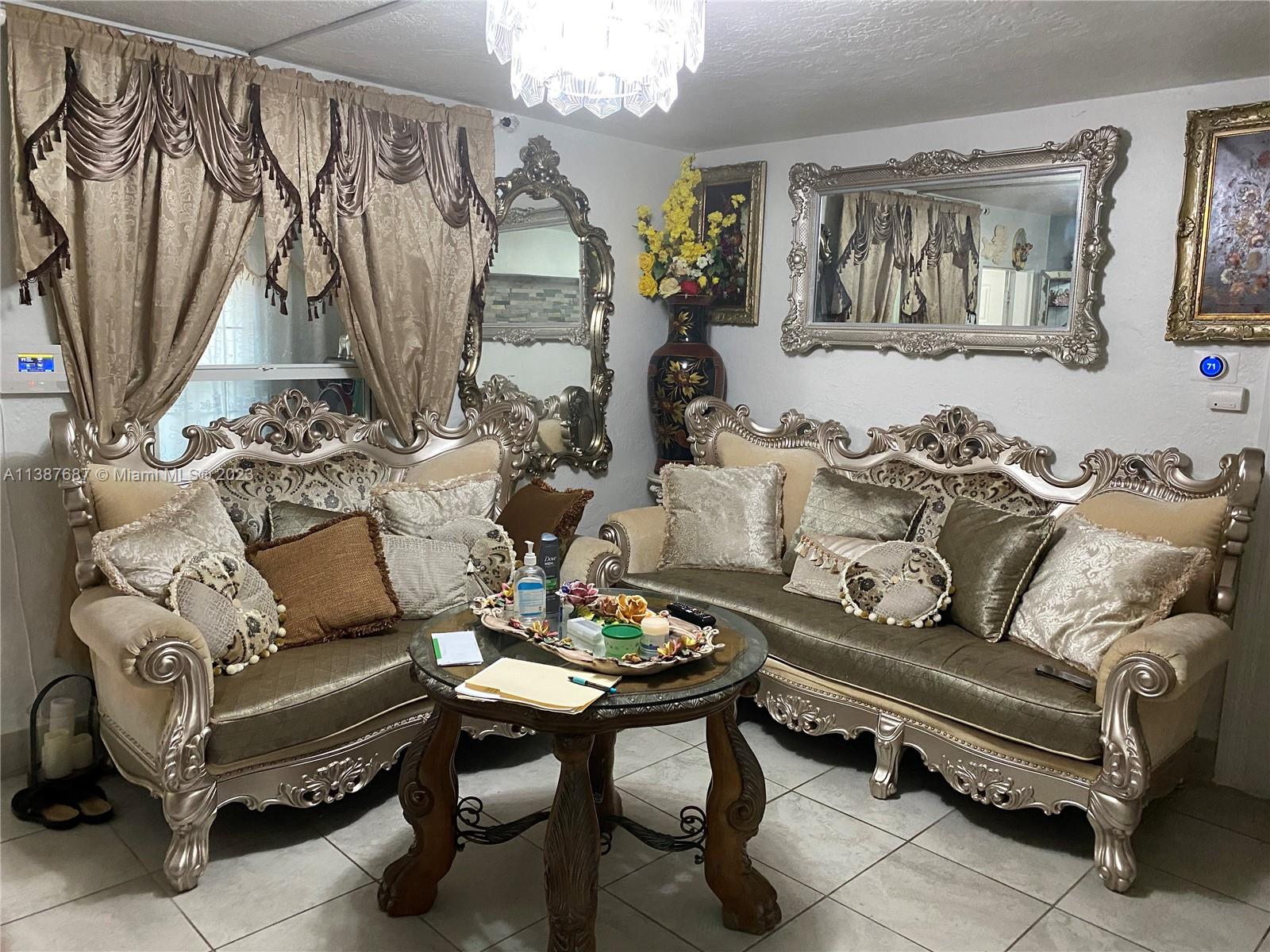 29220 Kansas Road Homestead, FL 33033 - Photo 6 of 16 a living room with furniture a couch and a window